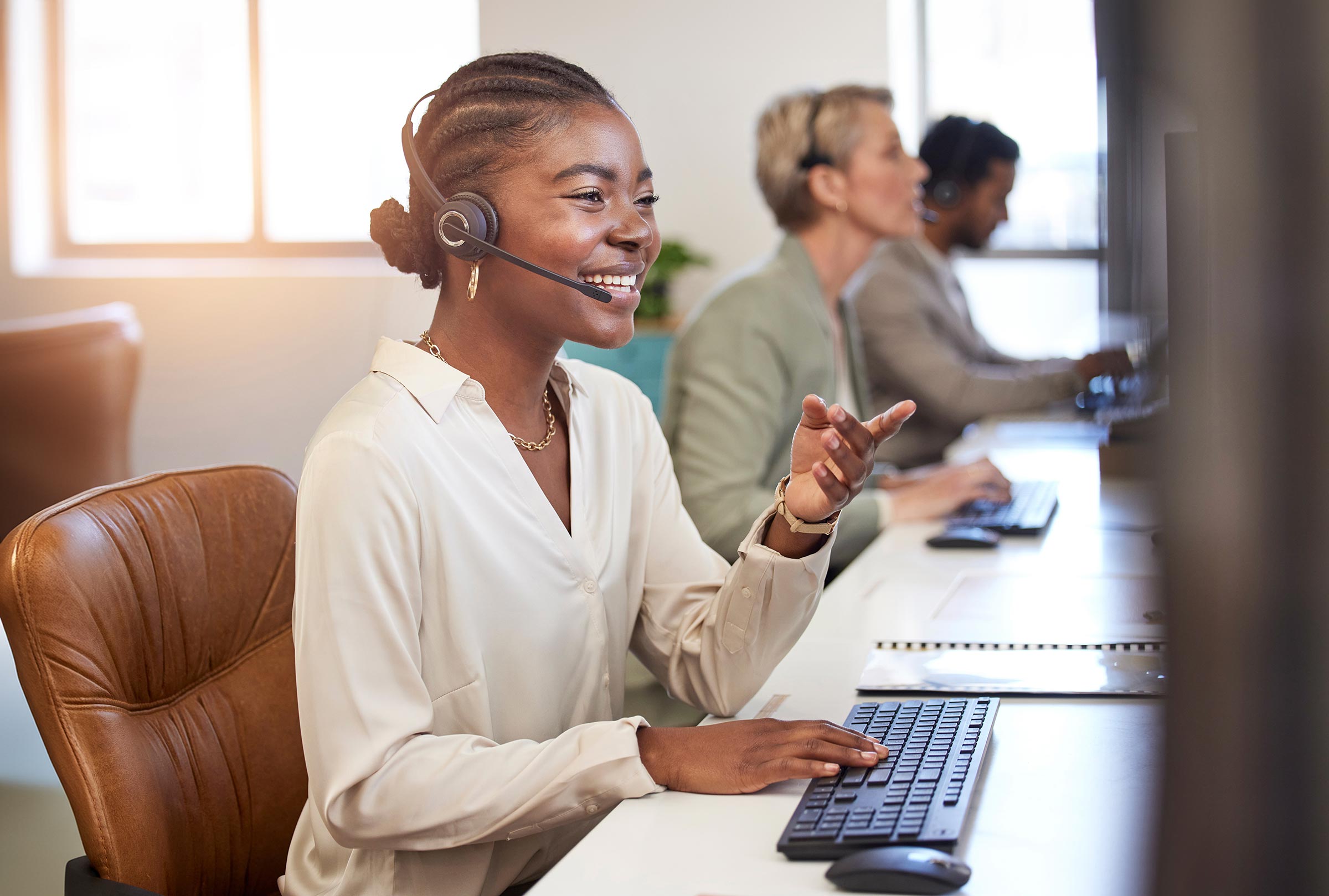 Happy call center agent helping customer