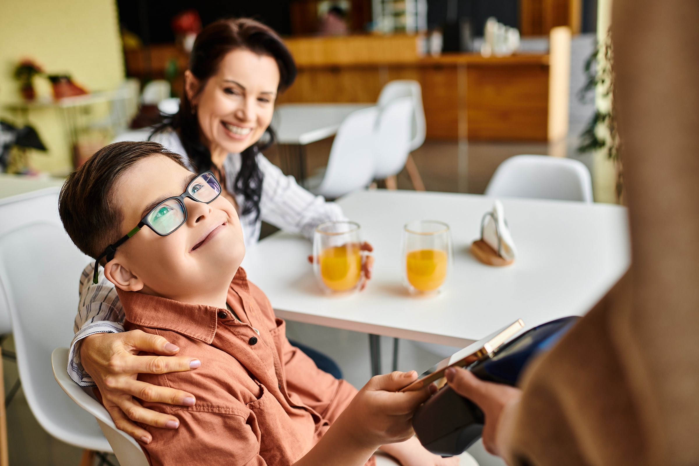 boy with down sydrome paying with tap to pay