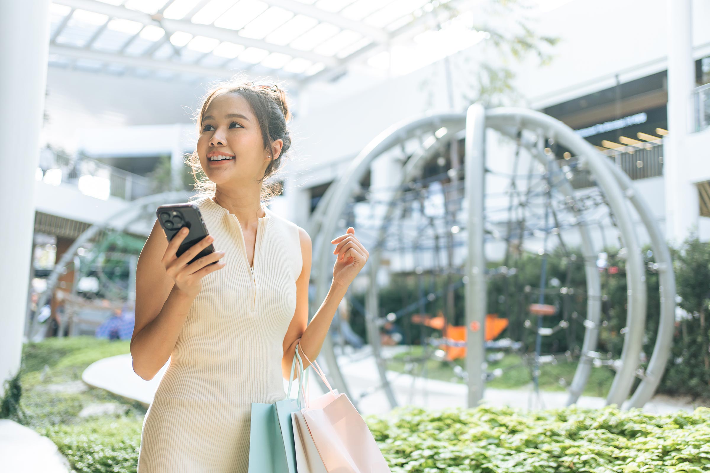 Beautiful woman shopping and using phone