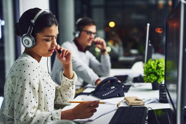 Call center agents working in office