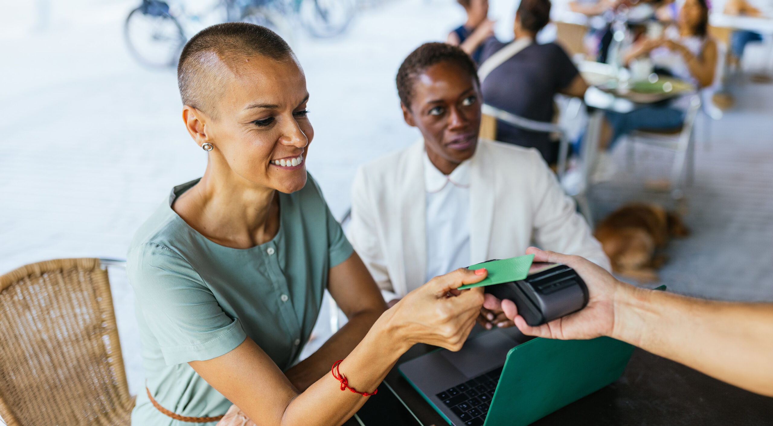 Making a credit card payment at a local cafe