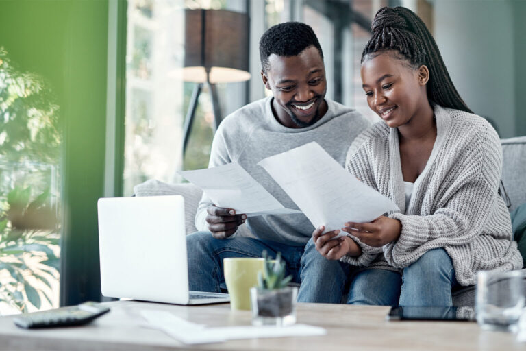 Couple reviewing bills and finances together