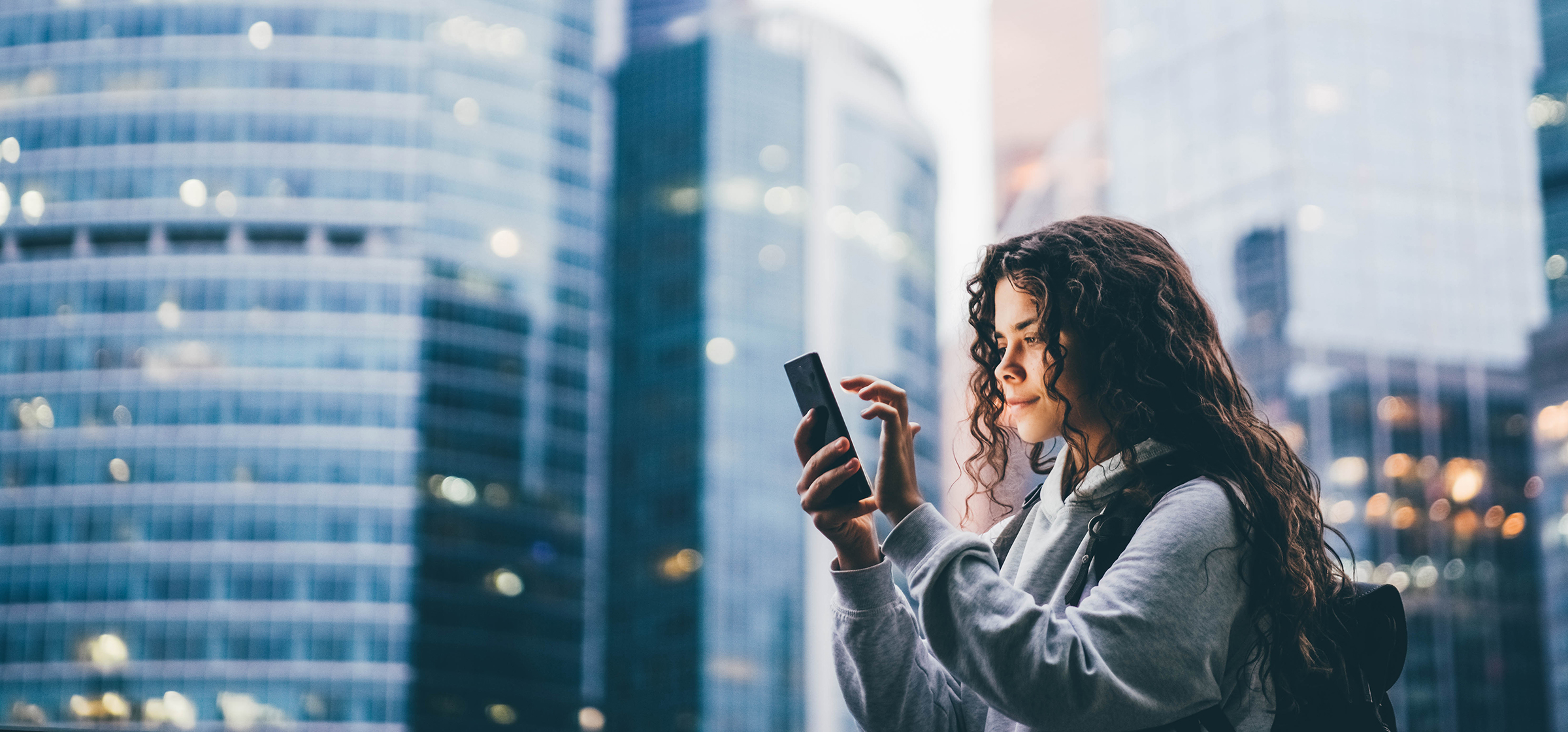 woman using phone in the city